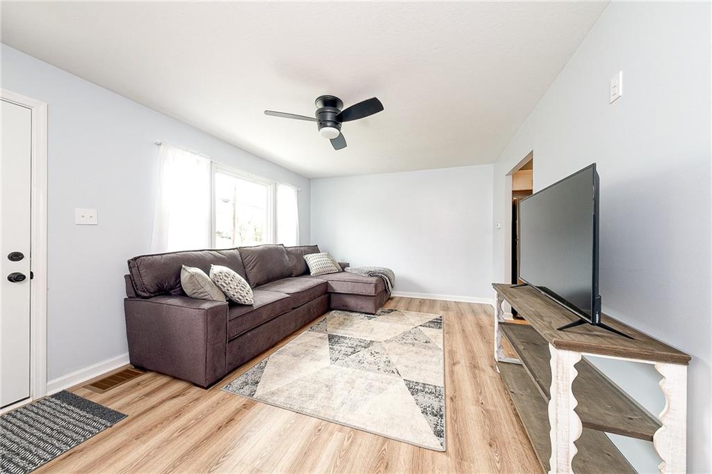 110 Neville Road Beaver, PA 15009 - Photo 4 of 22 a living room with furniture and a flat screen tv
