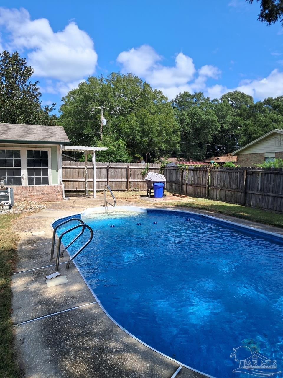 5358 Jenny Circle Pace, FL 32571 - Photo 1 of 16 a house view with a garden space