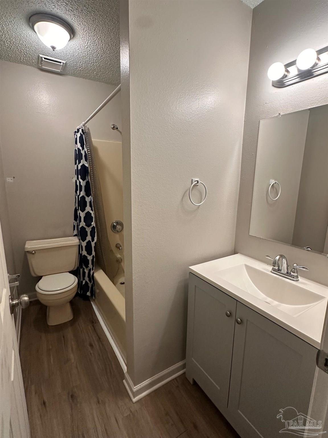 5358 Jenny Circle Pace, FL 32571 - Photo 6 of 16 a bathroom with a sink a toilet and shower