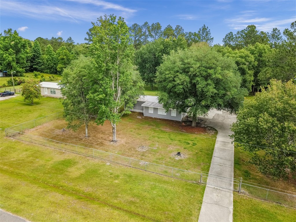 54129 Jerra Road Callahan, FL 32011 - Photo 5 of 34 a view of a swimming pool with a yard