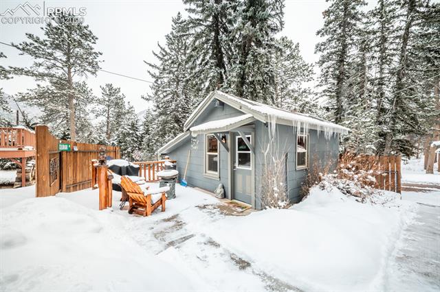9050 Picabo Road Cascade, CO 80809 - Photo 21 of 40 Cabin has a privacy fence and private yard area
