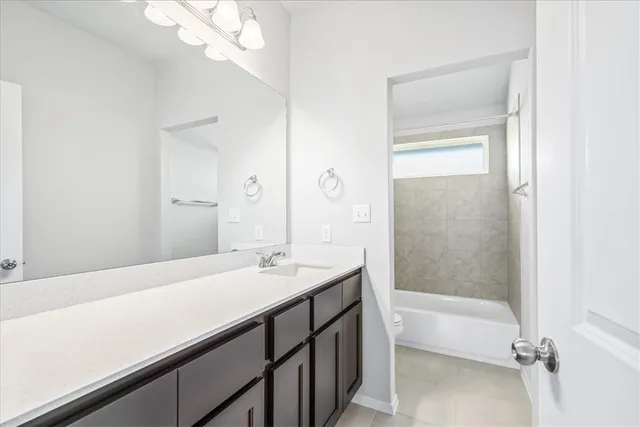 a bathroom with a sink a mirror and a bathtub