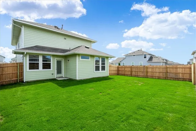 a view of a backyard of the house