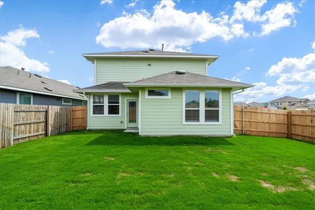 a front view of a house with yard