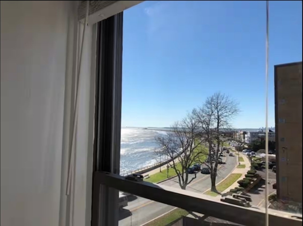 285 Lynn Shore Drive, Unit 203 Lynn, MA 01902 - Photo 11 of 13 a view of a balcony with chairs and wooden floor