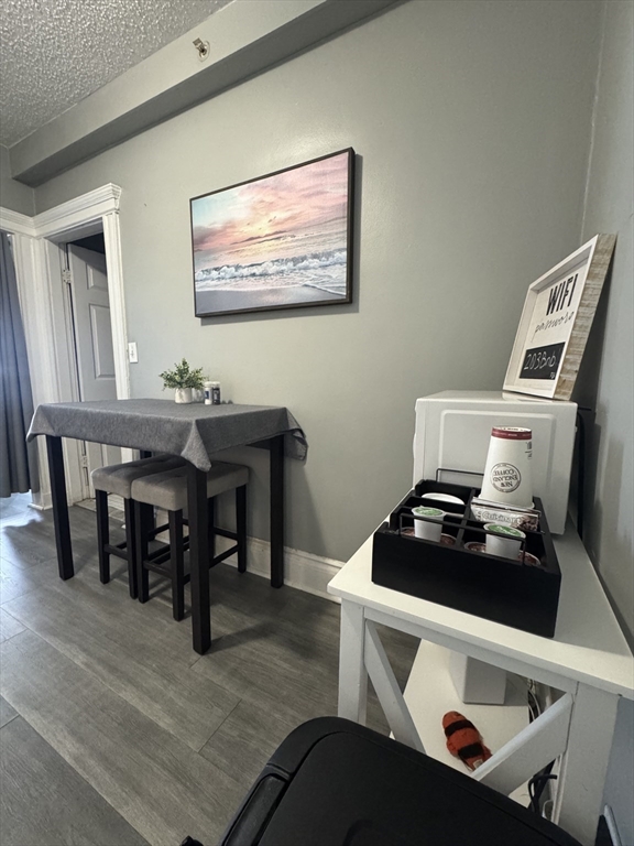 285 Lynn Shore Drive, Unit 203 Lynn, MA 01902 - Photo 3 of 13 a living room with furniture and wooden floor