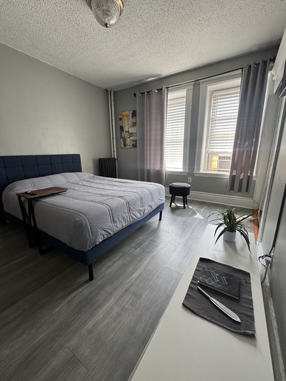 285 Lynn Shore Drive, Unit 203 Lynn, MA 01902 - Photo 7 of 13 a bedroom with a bed and a window