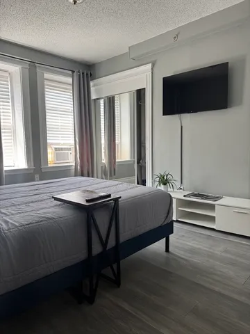 a view of a balcony with chairs and wooden floor