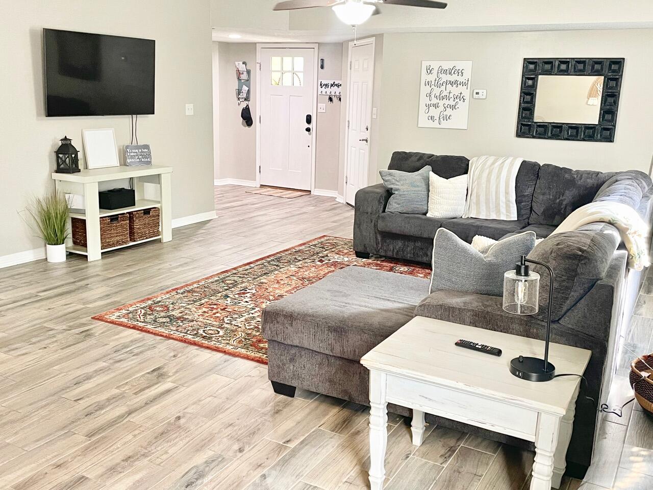115 Palmetto Drive Crestview, FL 32539 - Photo 12 of 27 a living room with furniture and a flat screen tv