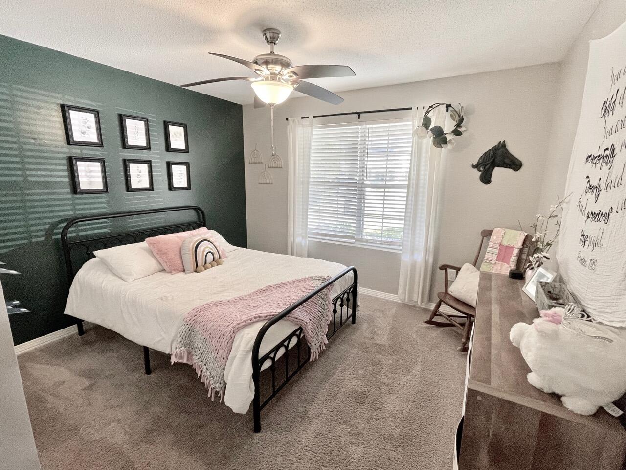 115 Palmetto Drive Crestview, FL 32539 - Photo 13 of 27 a spacious bedroom with a bed and a window