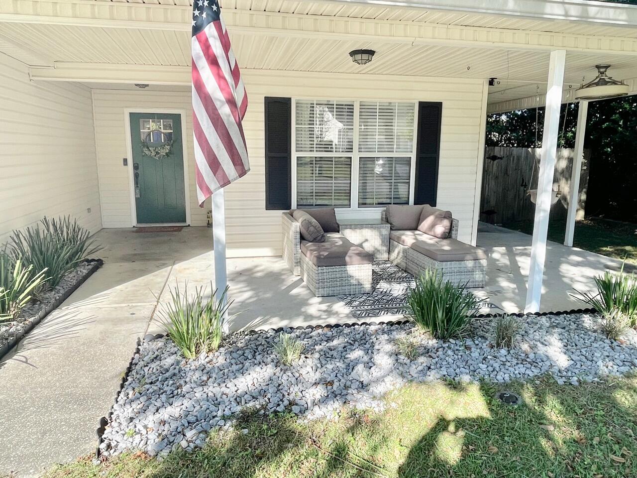 115 Palmetto Drive Crestview, FL 32539 - Photo 2 of 27 a lobby with furniture and floor to ceiling window