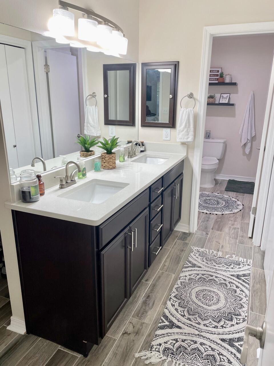 115 Palmetto Drive Crestview, FL 32539 - Photo 24 of 27 a bathroom with a sink double vanity and a mirror
