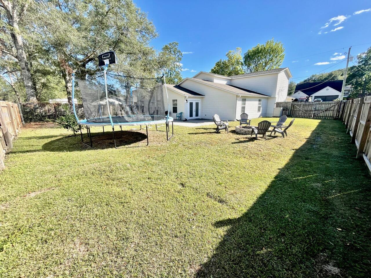 115 Palmetto Drive Crestview, FL 32539 - Photo 25 of 27 a view of a swimming pool with a patio