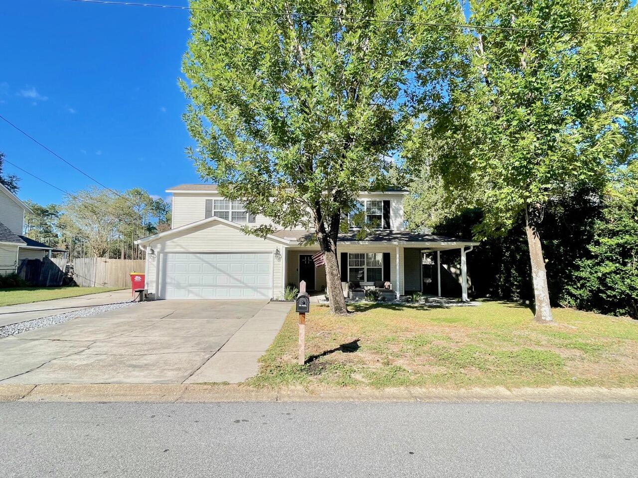 115 Palmetto Drive Crestview, FL 32539 - Photo 27 of 27 a front view of a house with a yard
