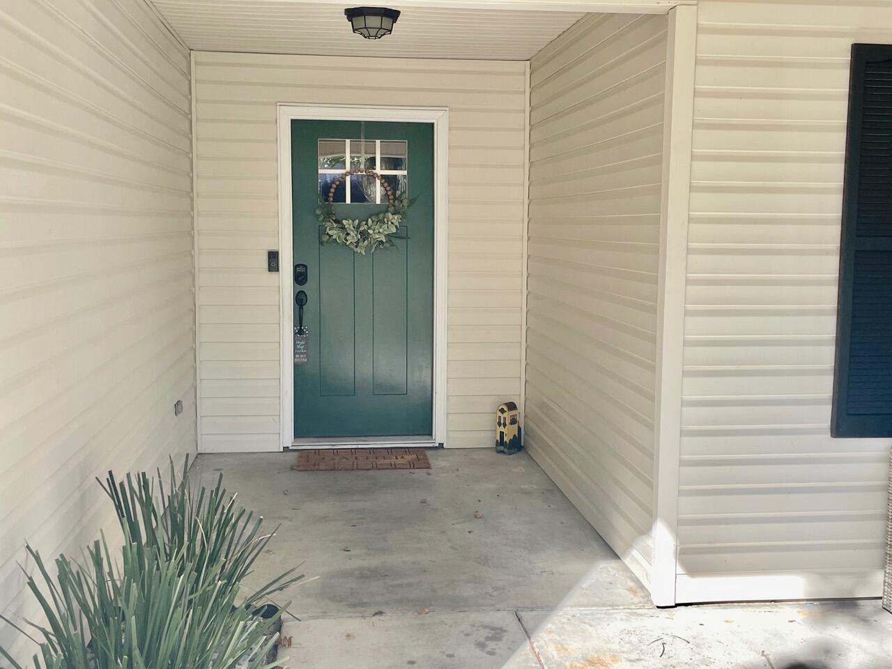 115 Palmetto Drive Crestview, FL 32539 - Photo 3 of 27 a view of a wooden door