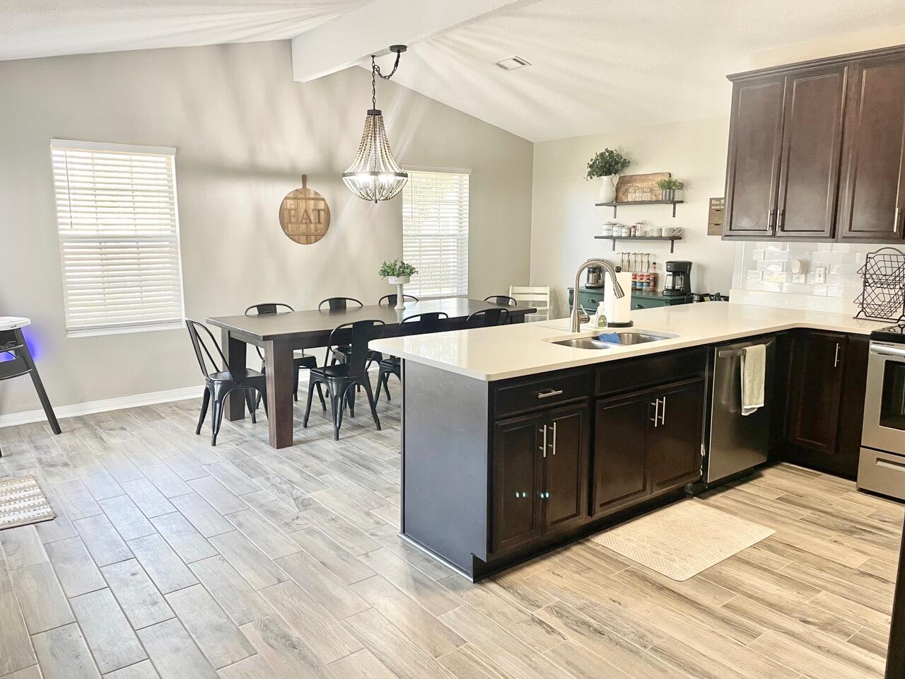 115 Palmetto Drive Crestview, FL 32539 - Photo 6 of 27 a kitchen with a sink and cabinets