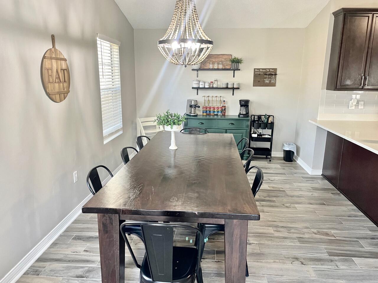 115 Palmetto Drive Crestview, FL 32539 - Photo 7 of 27 a view of kitchen island with wooden floor and stainless steel appliances