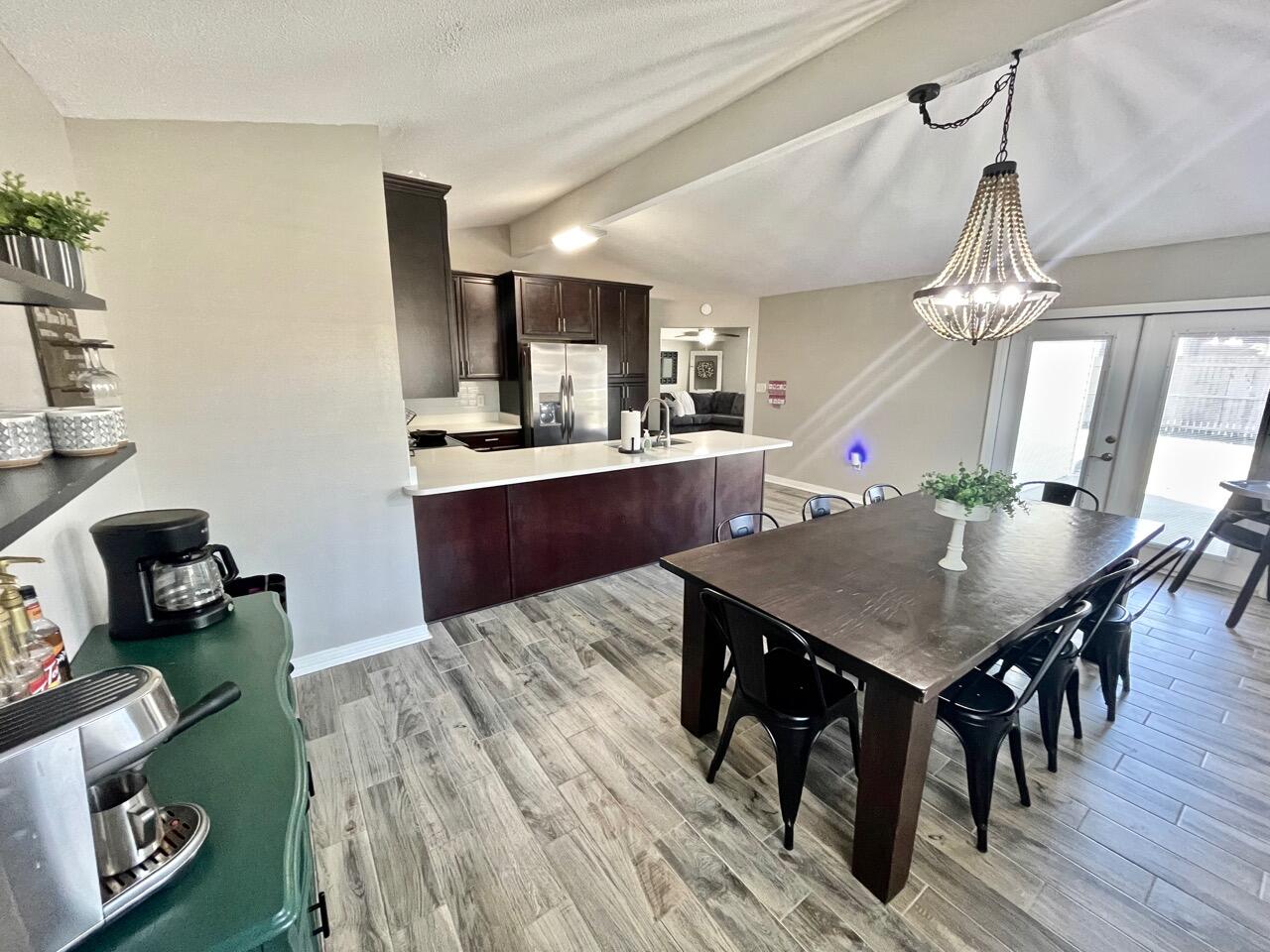 115 Palmetto Drive Crestview, FL 32539 - Photo 9 of 27 a view of a dining room with furniture and wooden floor