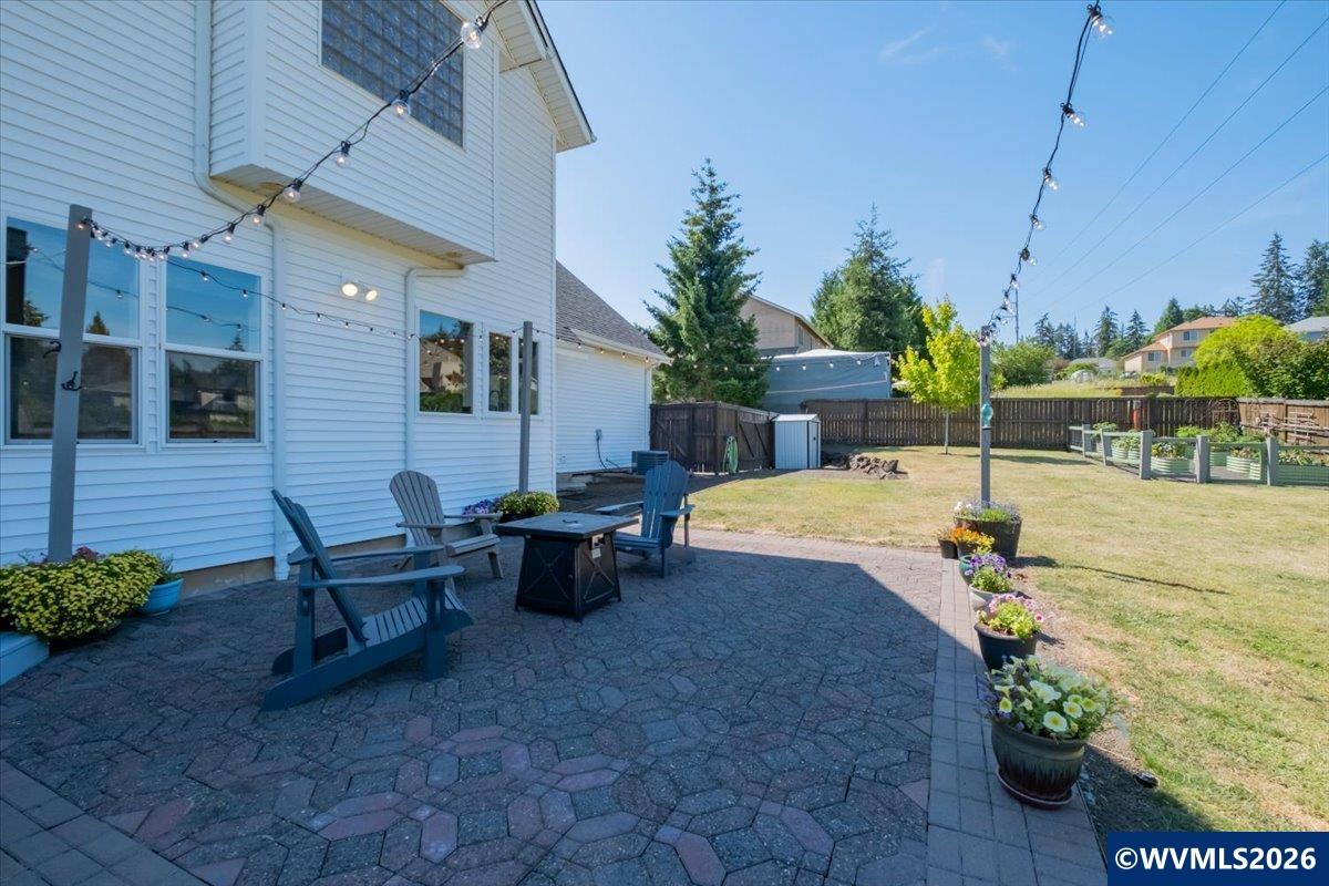 1492 Northwest Penny Lane Albany, OR 97321 - Photo 46 of 50 a view of a patio with table and chairs and potted plants