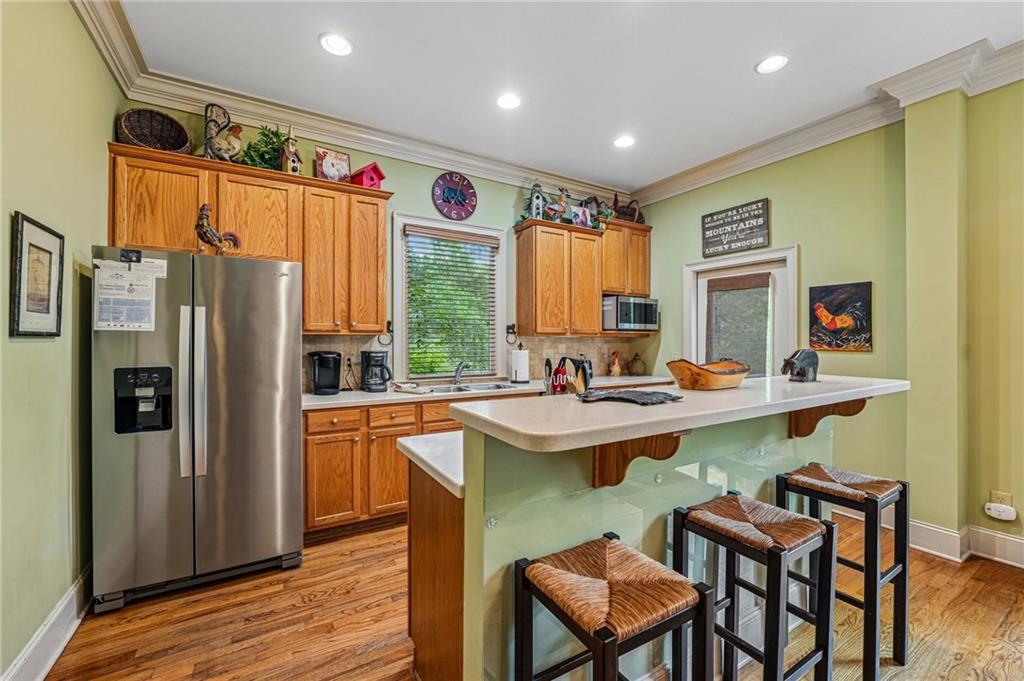 14 Laurel Ridge Lane Big Canoe, GA 30143 - Photo 22 of 72 a kitchen with stainless steel appliances granite countertop a refrigerator and a sink