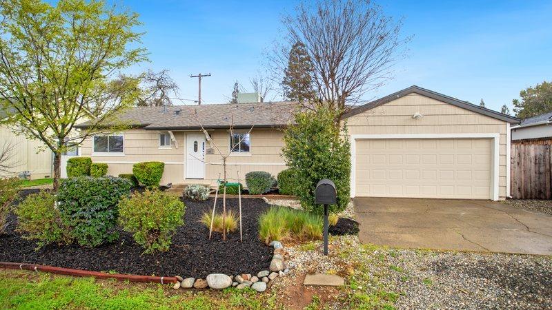 8967 Calvert Avenue Orangevale, CA 95662 - Photo 1 of 1 a front view of a house with a yard and garage