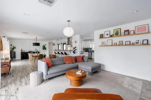 a living room with furniture and a table