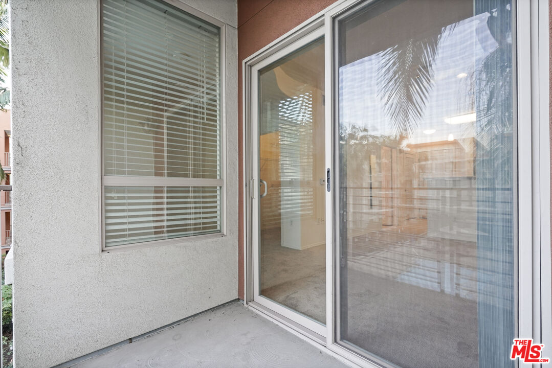 100 South Alameda Street, Unit 346 Los Angeles, CA 90012 - Photo 14 of 24 a bathroom with a glass shower door