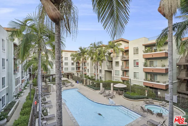 a view of balcony with outdoor seating and city view