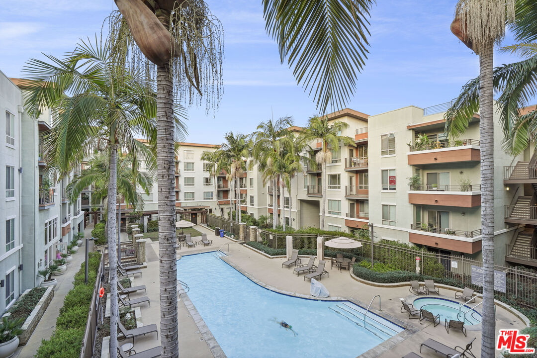 100 South Alameda Street, Unit 346 Los Angeles, CA 90012 - Photo 17 of 24 a view of balcony with outdoor seating and city view