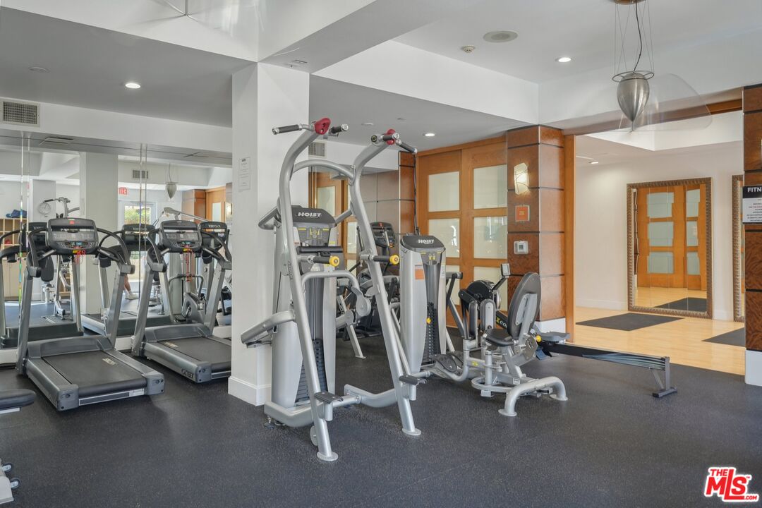 100 South Alameda Street, Unit 346 Los Angeles, CA 90012 - Photo 23 of 24 a view of a room with gym equipment