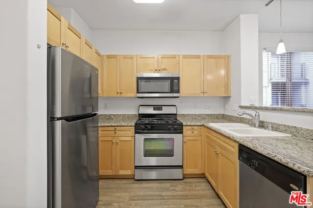 a kitchen with a stove microwave and refrigerator