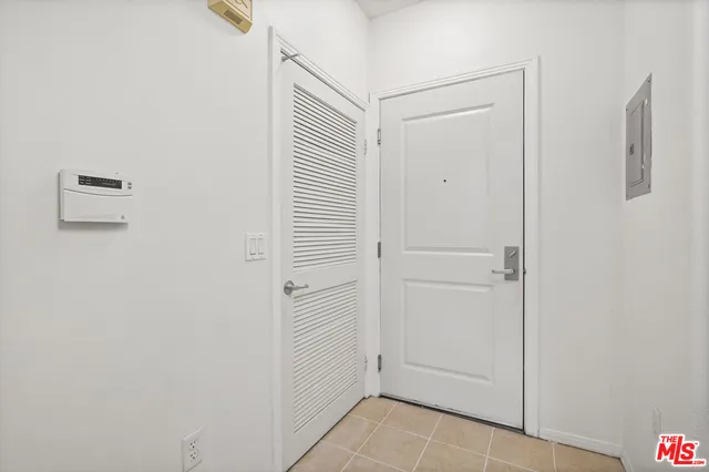 a view of a hallway with closet area