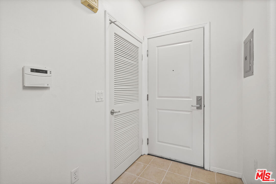 100 South Alameda Street, Unit 346 Los Angeles, CA 90012 - Photo 8 of 24 a view of a hallway with closet area