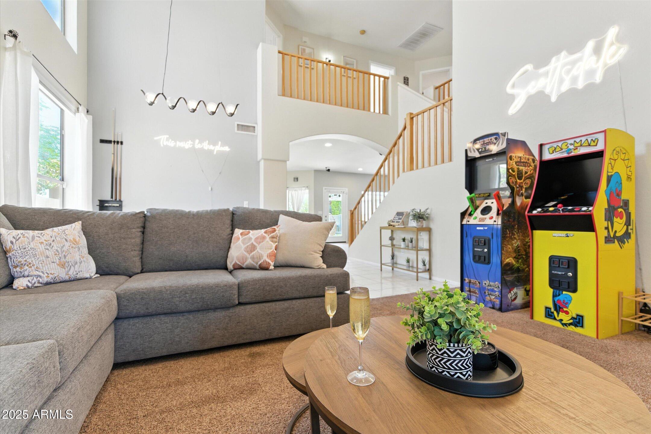 8083 East Michelle Drive Scottsdale, AZ 85255 - Photo 15 of 40 a living room with furniture and a fireplace