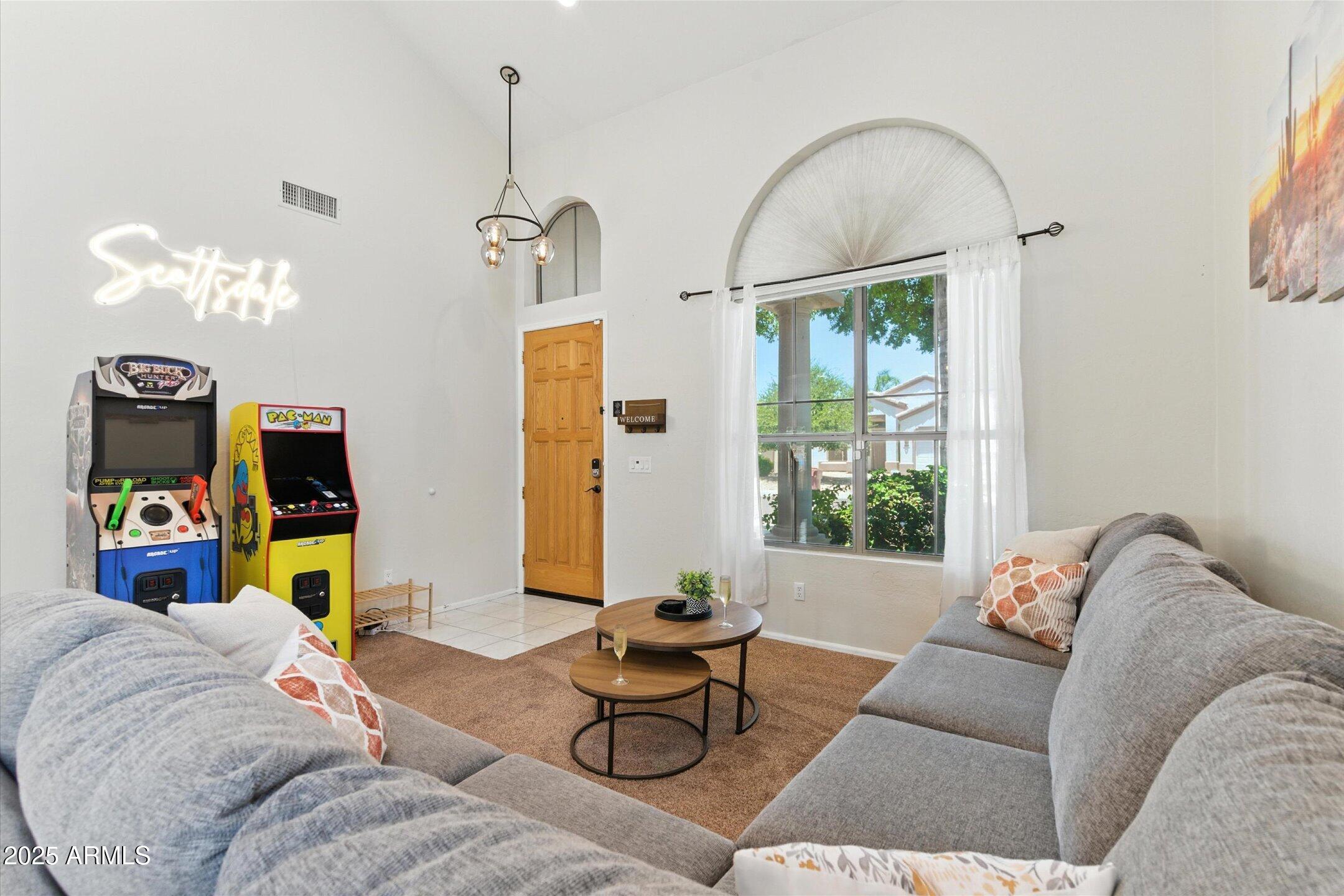 8083 East Michelle Drive Scottsdale, AZ 85255 - Photo 17 of 40 a living room with furniture flowerpot and window