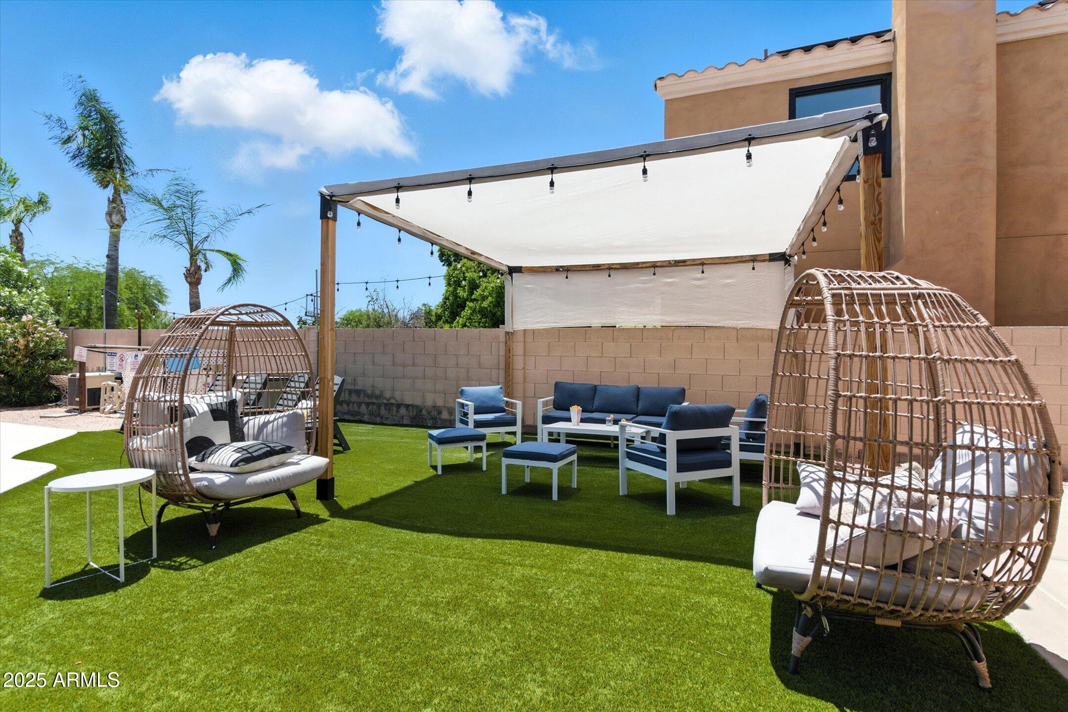 8083 East Michelle Drive Scottsdale, AZ 85255 - Photo 2 of 40 a view of a chairs and couches in the patio