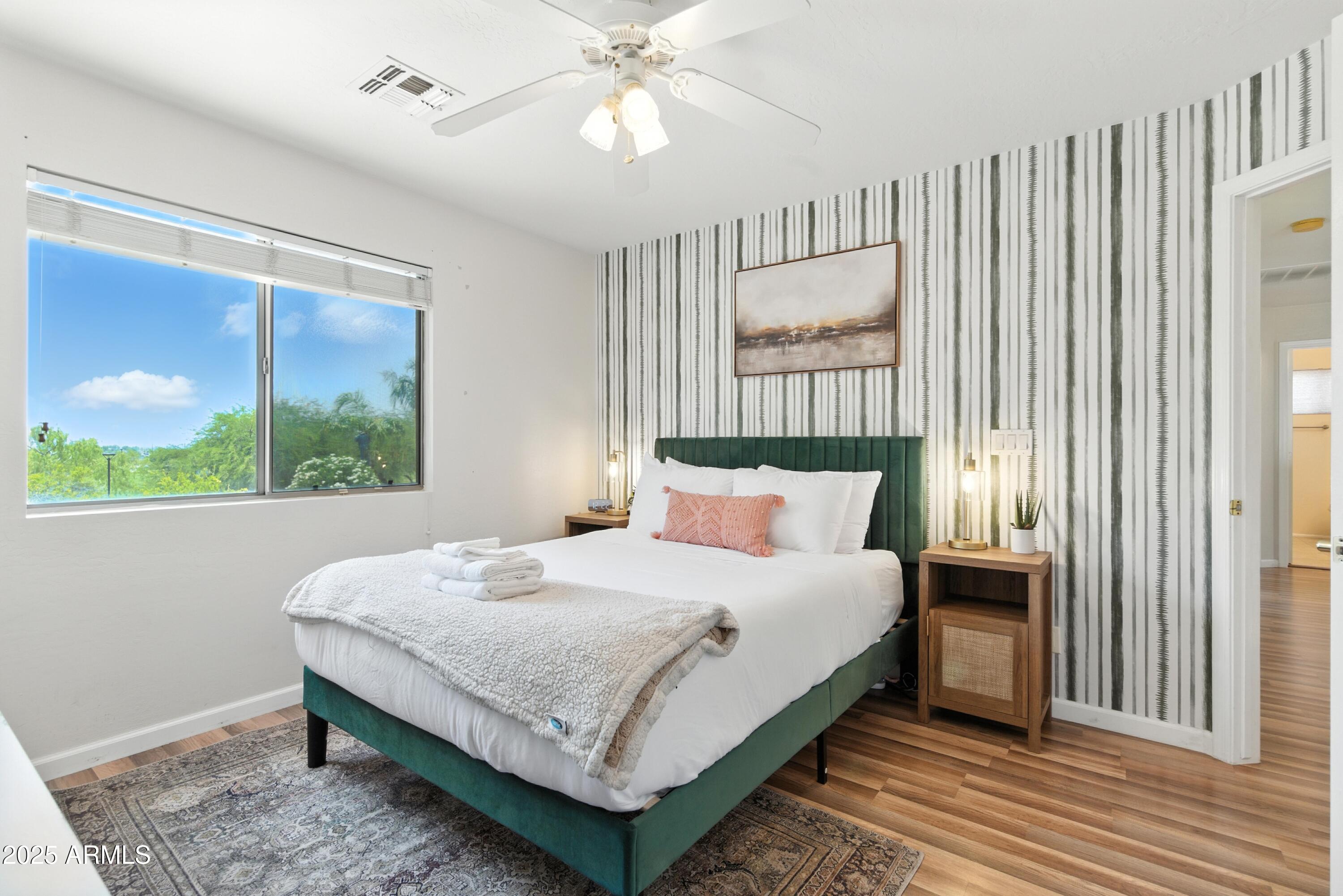 8083 East Michelle Drive Scottsdale, AZ 85255 - Photo 28 of 40 a bedroom with a large bed and a window