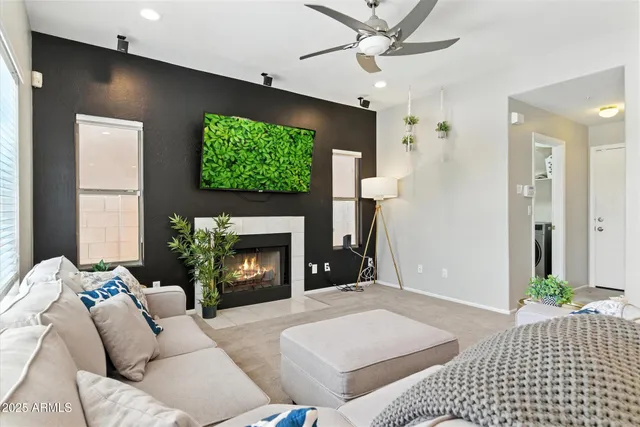 a living room with furniture and a fireplace