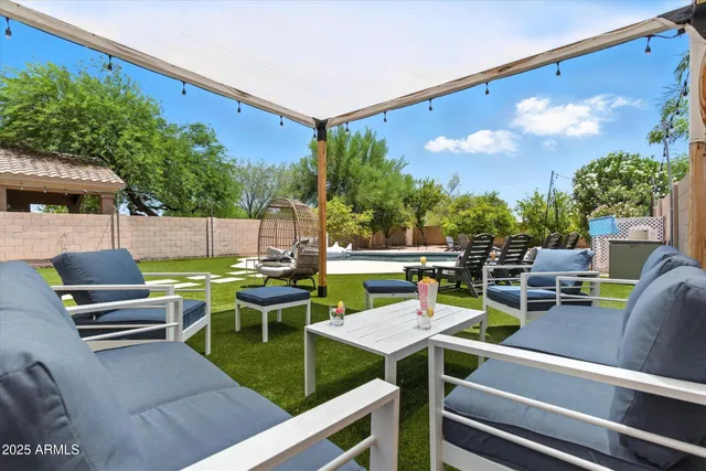 a couple of chairs sitting in the yard