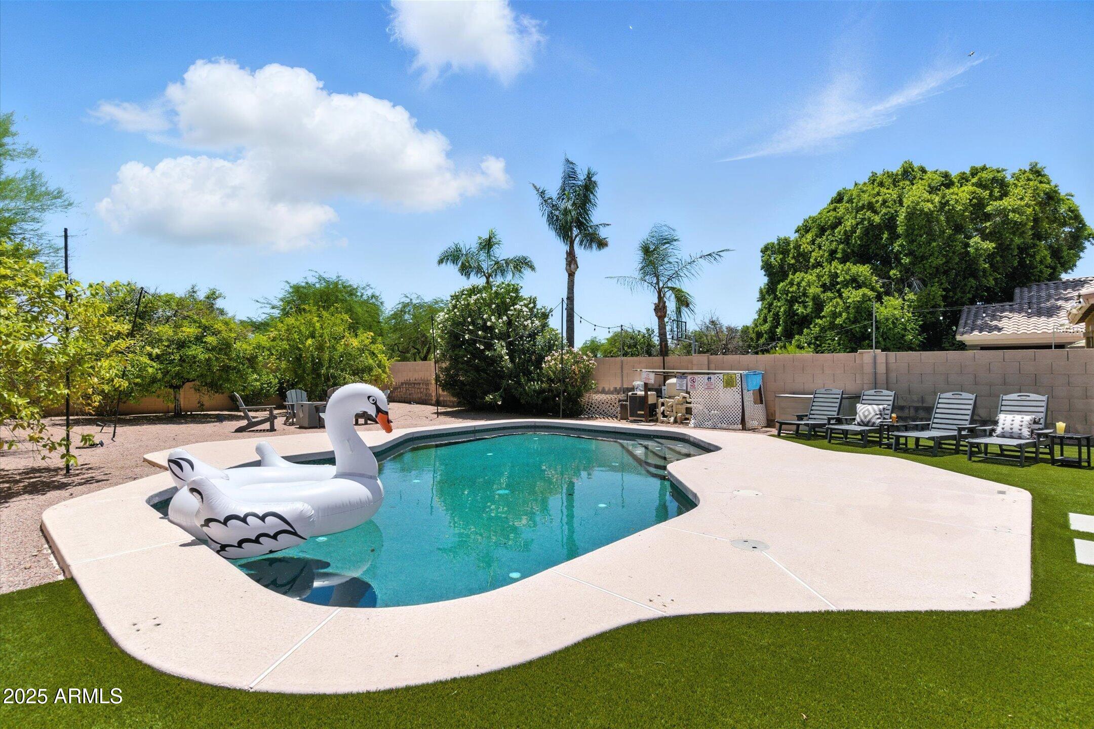 8083 East Michelle Drive Scottsdale, AZ 85255 - Photo 37 of 40 a view of a swimming pool with a patio