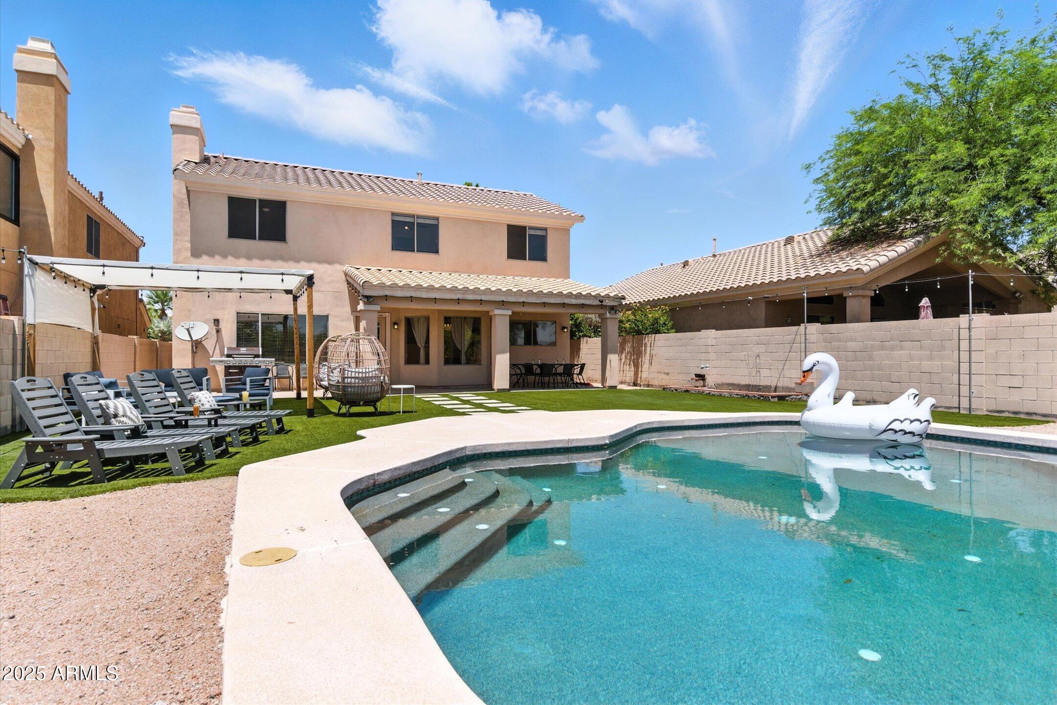 8083 East Michelle Drive Scottsdale, AZ 85255 - Photo 38 of 40 a view of a house with swimming pool and sitting area