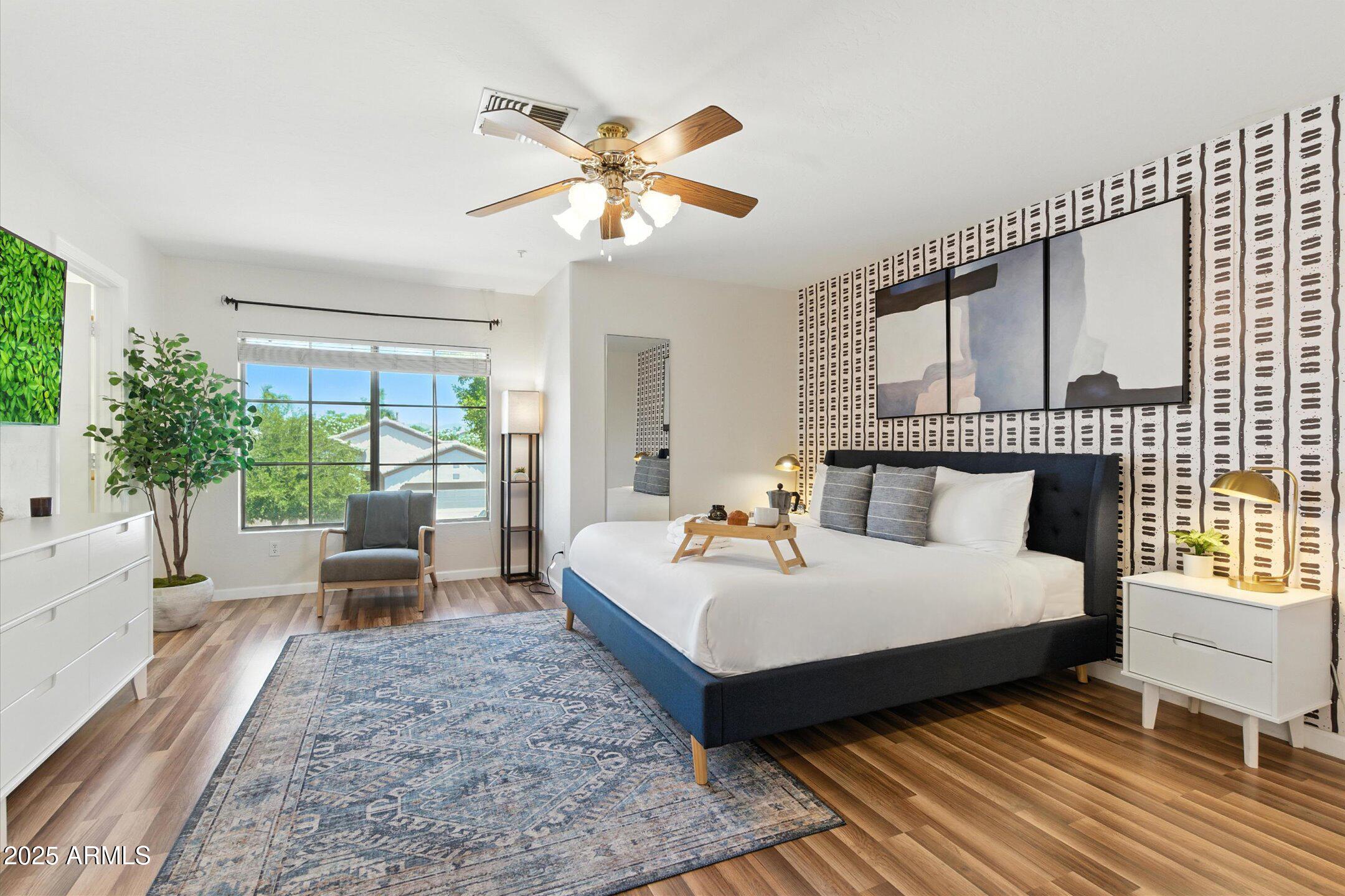 8083 East Michelle Drive Scottsdale, AZ 85255 - Photo 5 of 40 a bedroom with a bed and large windows