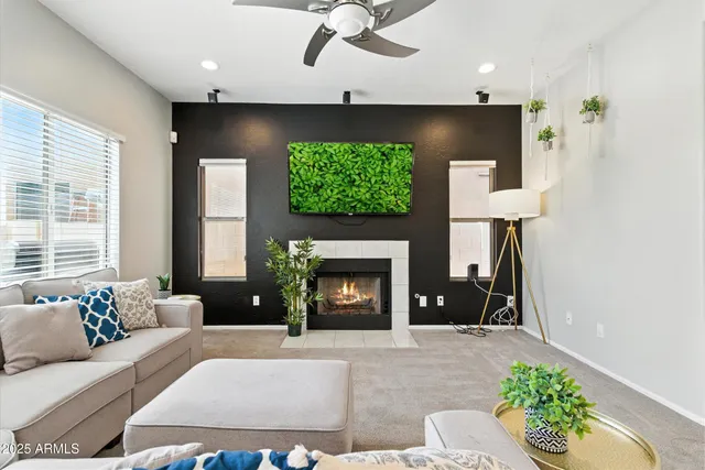 a living room with furniture and a fireplace