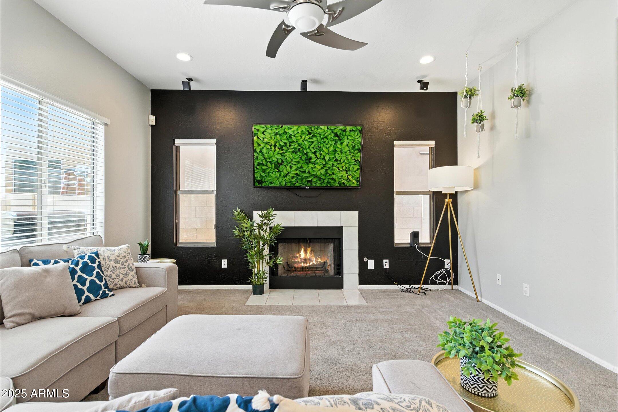 8083 East Michelle Drive Scottsdale, AZ 85255 - Photo 6 of 40 a living room with furniture and a fireplace