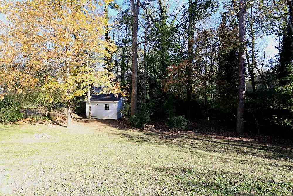 6628 Keystone Drive Raleigh, NC 27612 - Photo 28 of 28 Fabulous fenced backyard with a shed (as is). Backyard