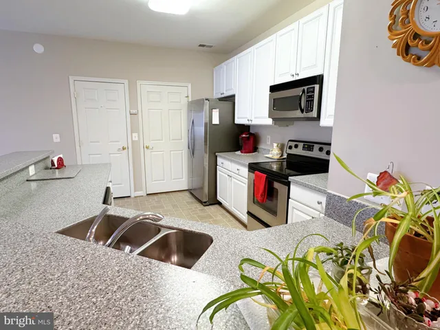a view of a wooden fence and trees in the background