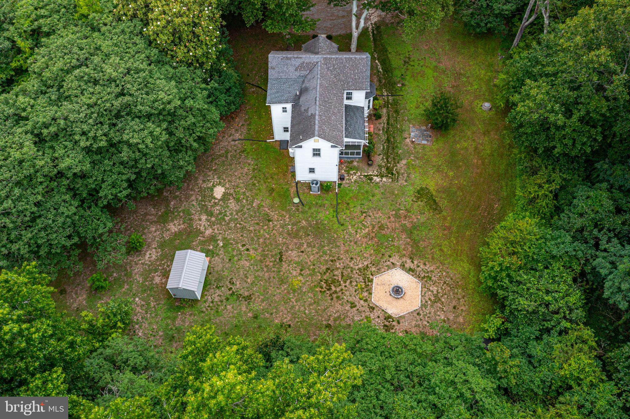 3952 Irvington Road Irvington, VA 22480 - Photo 60 of 77 an aerial view of a house with a swimming pool and garden view