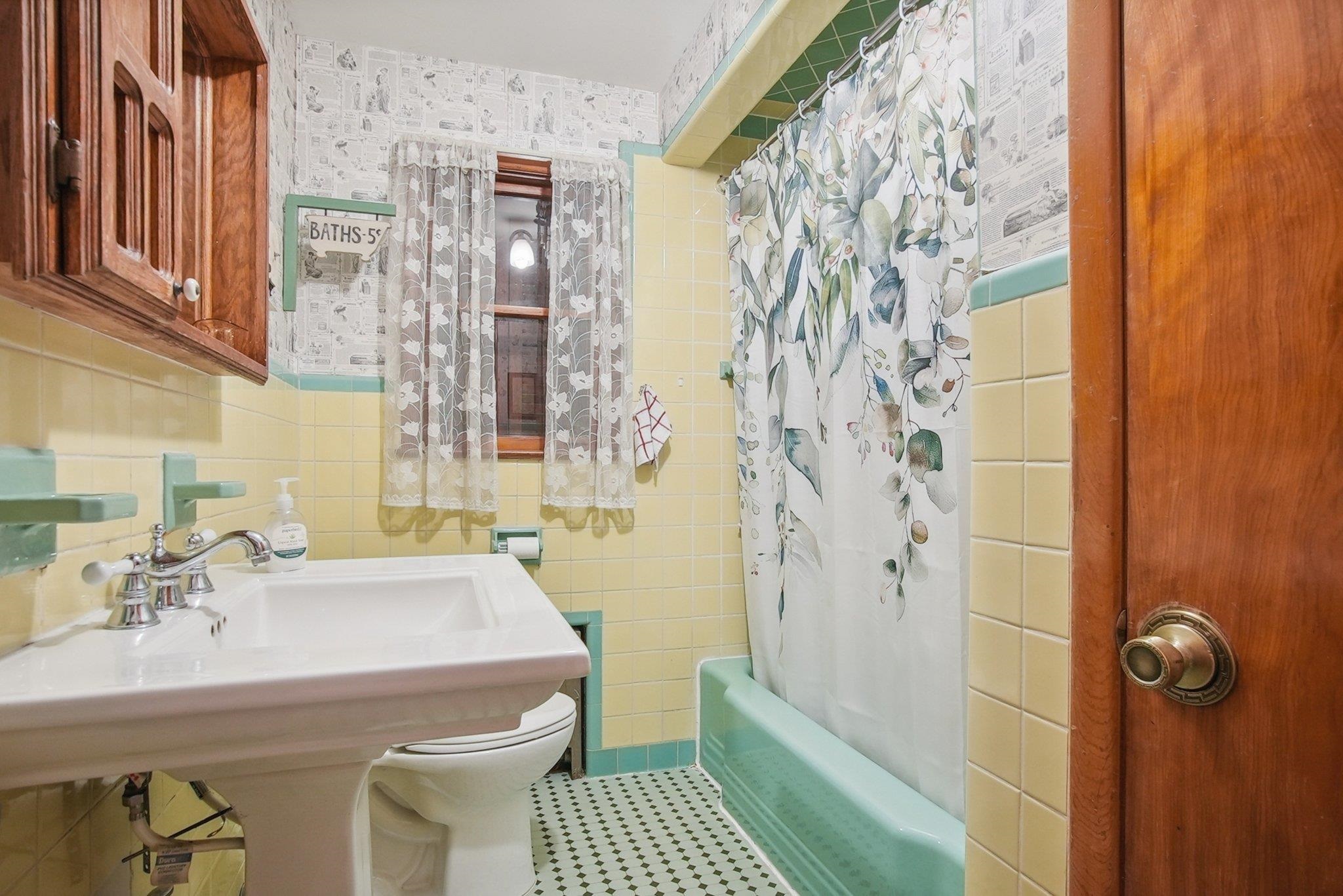 42 Frederick Street Carteret, NJ 07008 - Photo 11 of 15 a bathroom with a sink and a mirror