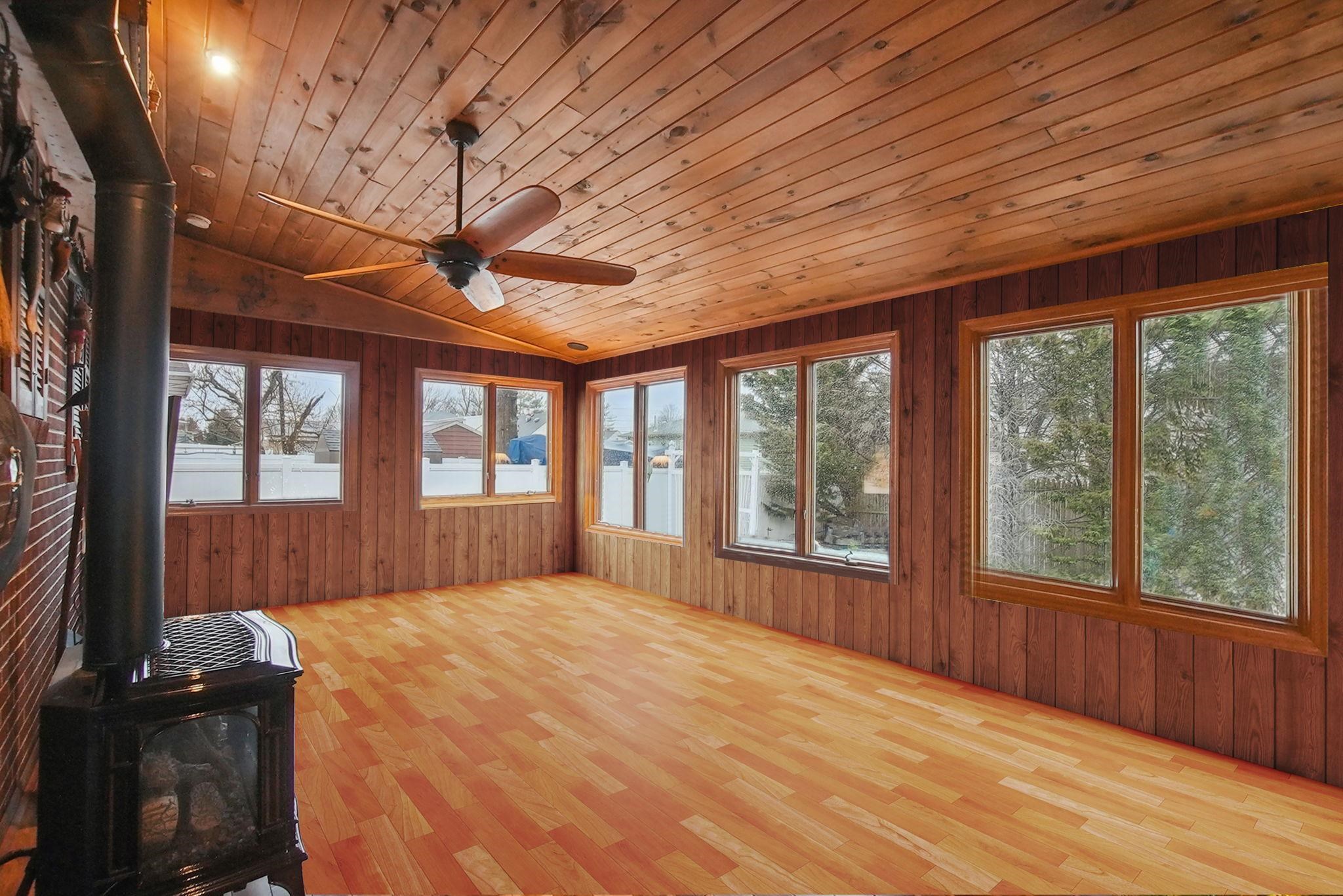 42 Frederick Street Carteret, NJ 07008 - Photo 13 of 15 a bedroom with a large bed and large windows