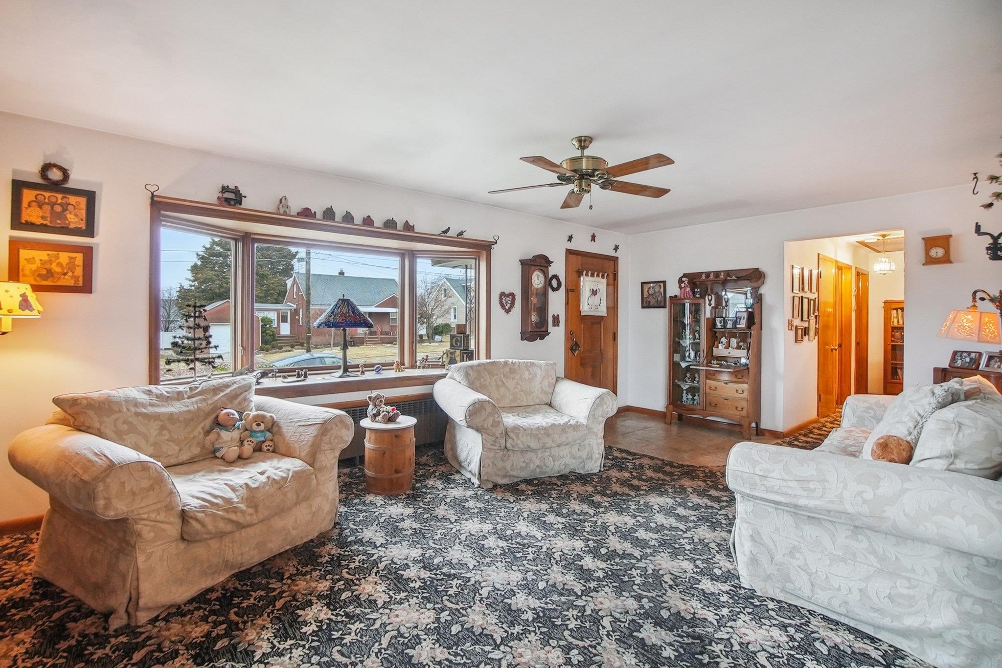 42 Frederick Street Carteret, NJ 07008 - Photo 2 of 15 a living room with furniture and a large window